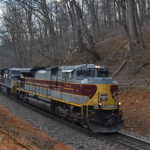 SD70ACe #1074, the Delaware Lackawanna & Western heritage unit , leads NS train 290 west up Linden Hill on 2/20/2017