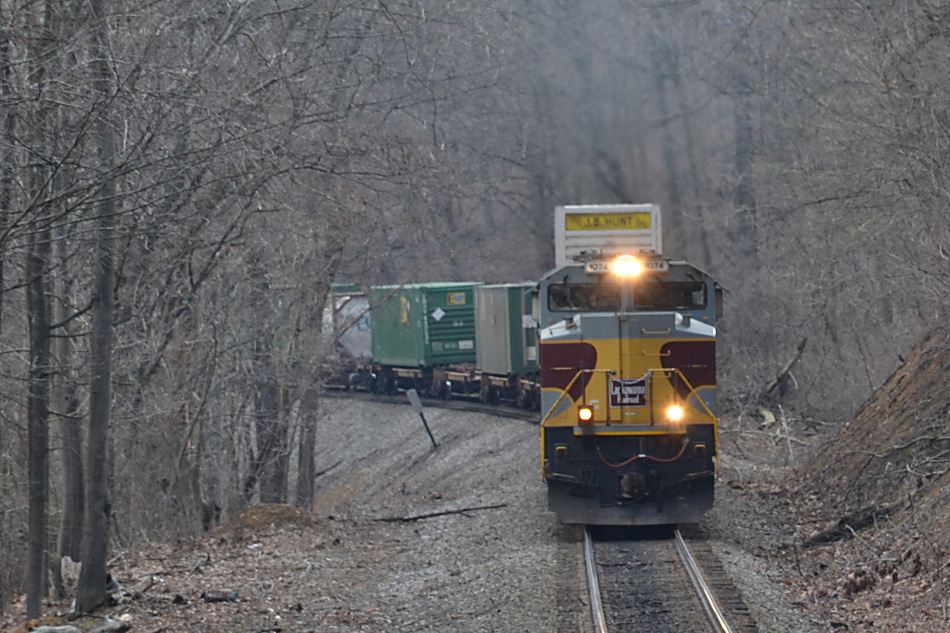 SD70ACe #1074, the Delaware Lackawanna & Western heritage unit , leads NS train 290 west up Linden Hill on 2/20/2017