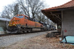 NS train 211 is led by BNSF ES44C4 #6870, NS D9-44CW #9344, and NS SD70M-2 #2656 past the old Southern Railway depot at Markham, Va on 2/16/2017