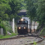 NS train 227 is led by SD70M #2597 as it crests Linden Hill in Virginia on 7/13/2017.