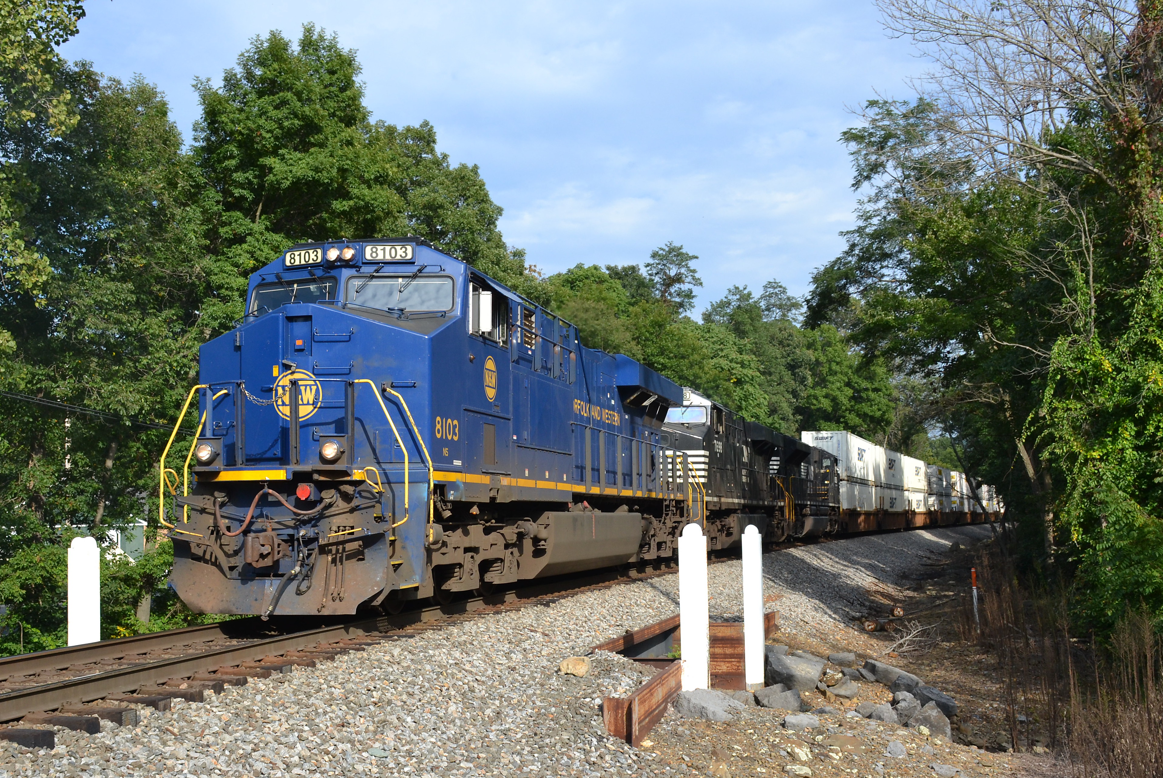 NS train 214 is led by NS ES44AC #8103 (N&W heritage unit) as it heads west through Linden, Va on 8/31/2017.