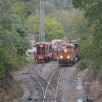 NS train 211 passes a MoW train at the top of Linden Hill in Virginia on 10/10/2018.