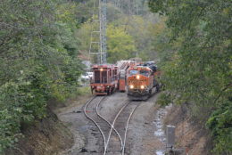 NS train 211 passes a MoW train at the top of Linden Hill in Virginia on 10/10/2018.