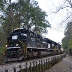 NS SD70ACe #1073 (Penn Central heritage unit) leads train 203 east down Linden Hill on the NS B-line on 10/06/2018.