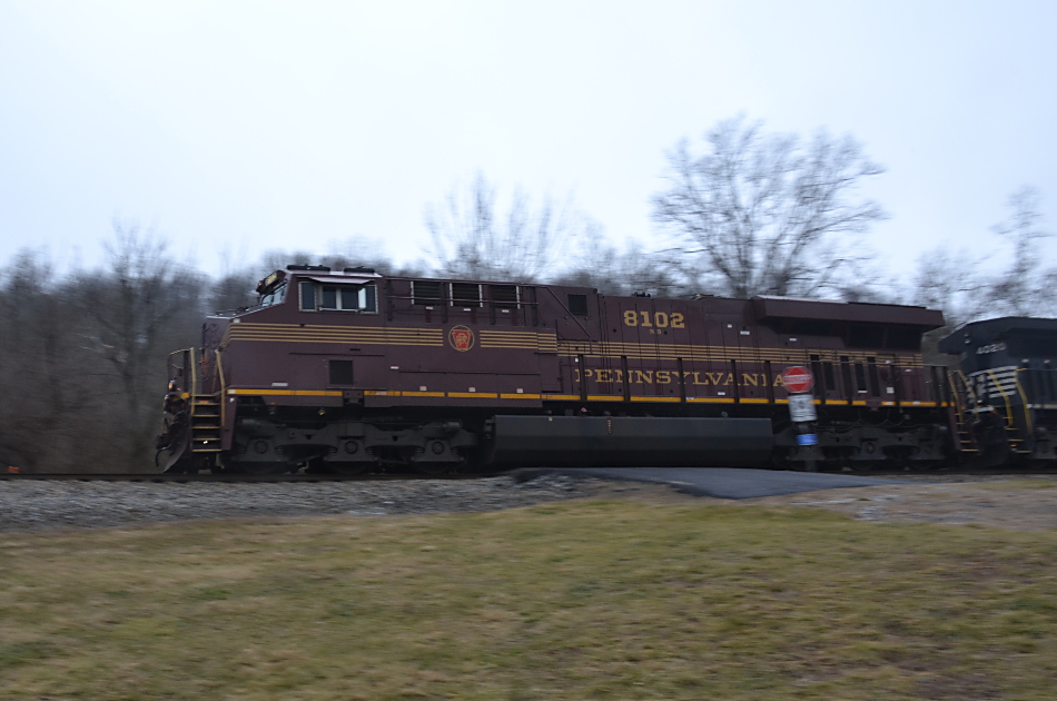 SD70ACe #8102 (PRR Heritage unit) leads NS train 211 by the B44 milepost in Linden, VA on 2/7/2019