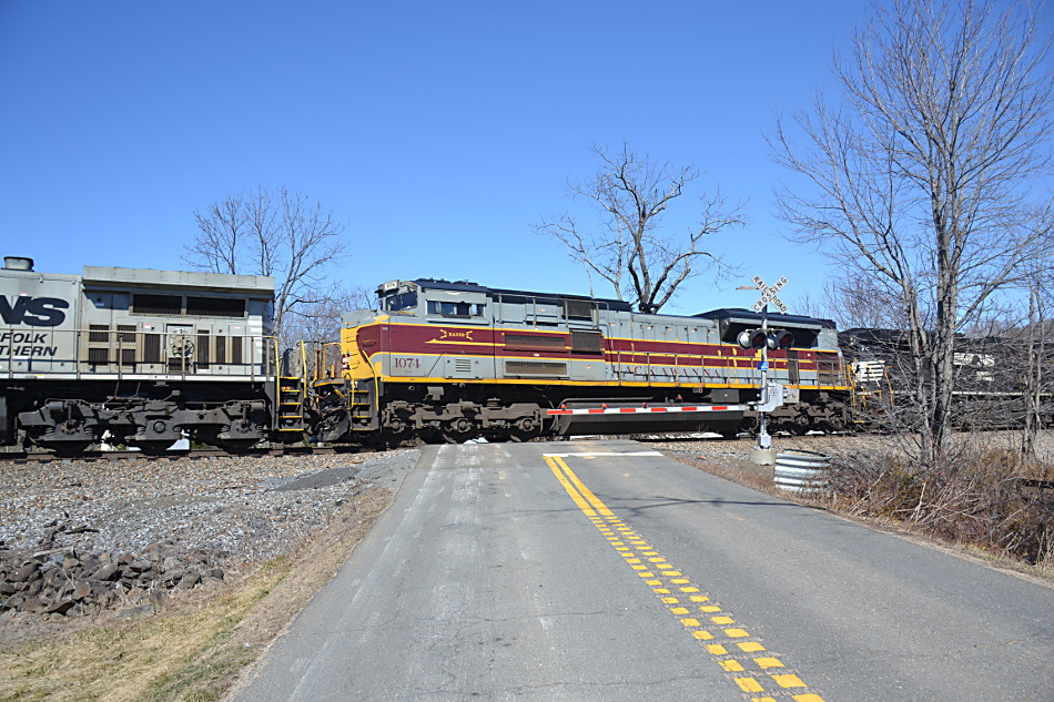  
NS SD70ACe #1074 (the Delaware Lackawanna & Western heritage unit) trails 2nd of 3 units past Markham, VA on 3/5/2019. 