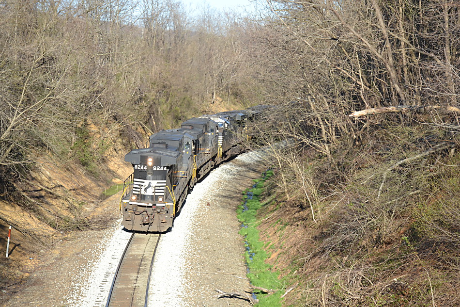 NS D9-44CW #9244 running long hood forward leads NS train 12R over Linden Hill on 4/3/2019.   