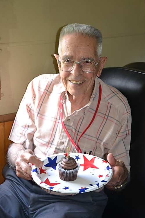 Dad with his birthday cupcake (we decided not to try to fit 90 candles).