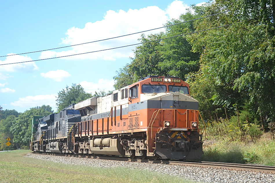  211 is led by a pair of NS ES-44ACs (#8105 & #8125) along with D9-44CW #9344 east near the control point at Woods in Front Royal, VA on 9/18/2019. 