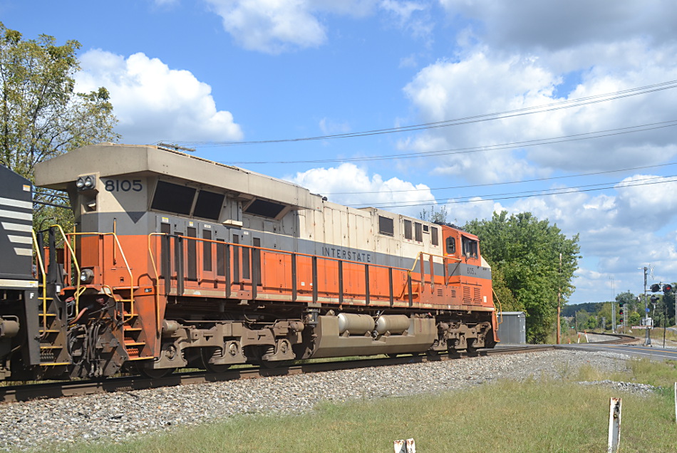  With the Interstate Railroad heritage unit leading the way, NS train 211 has a clear signal east on the mainline at Woods on 9/18/2019. 