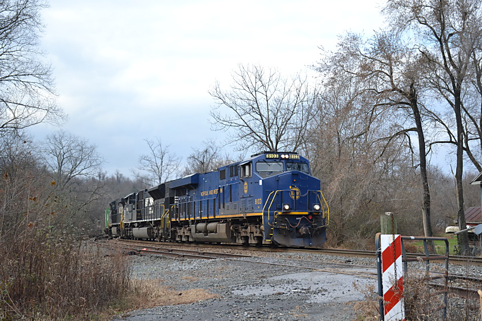 NS train 211 passes east through Linden, VA with ES-44AC #8103 (Norfolk and Western heritage unit), SD70ACU #7295 and D9-44CW #9919 leading the way on 11/20/2019.  