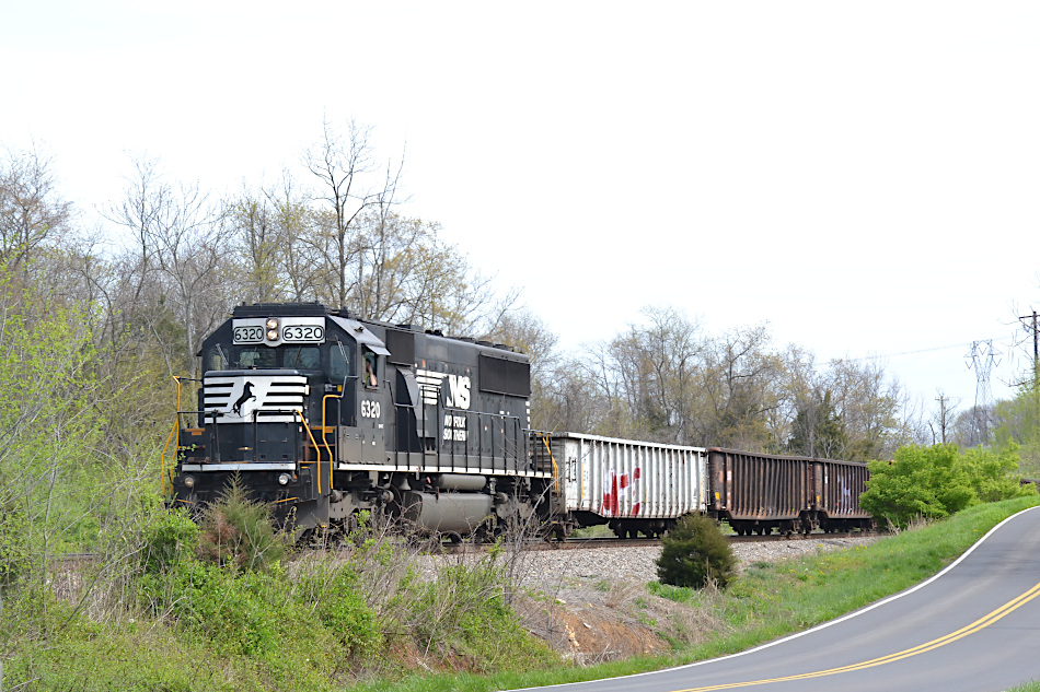  On 4/7/2020, NS SD40-2 #6320 leads train 92Q.  They are stopped for eastbound traffic, waiting on the siding at the control point at Woods.