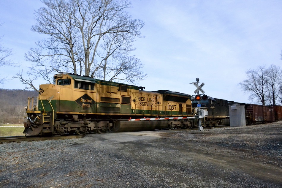 NS train 12R is led west at Belle Meade, VA by NS SD70ACe #1067 (the Reading Company Heritage unit) on 12/15/2020.