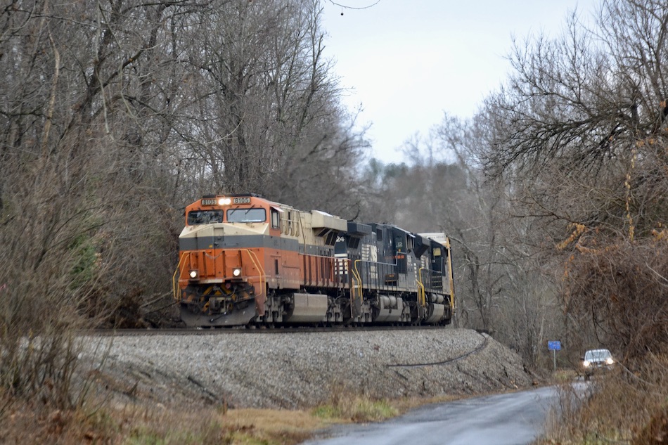 Specially painted NS ES44AC 8105 leads NS train 275 east through Markham, Virginia on December 7, 2022.