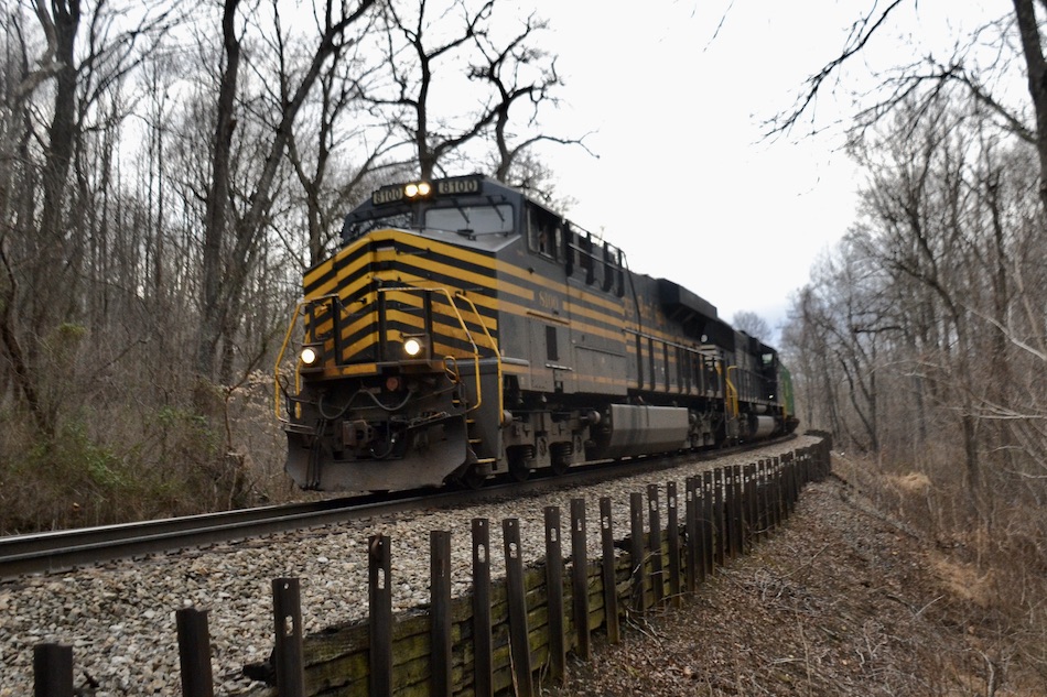 Close up shot of the locomotive.  The conductor opened the window to wave.