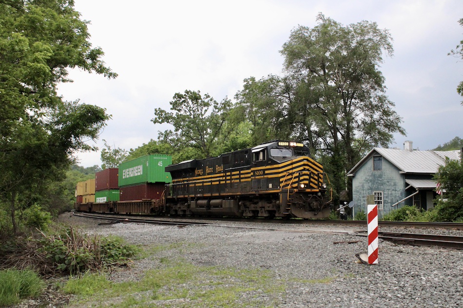 Specially painted Norfolk Southern Nickel Plate Road heritage unit leads a freight train through rural Linden, Virginia.
