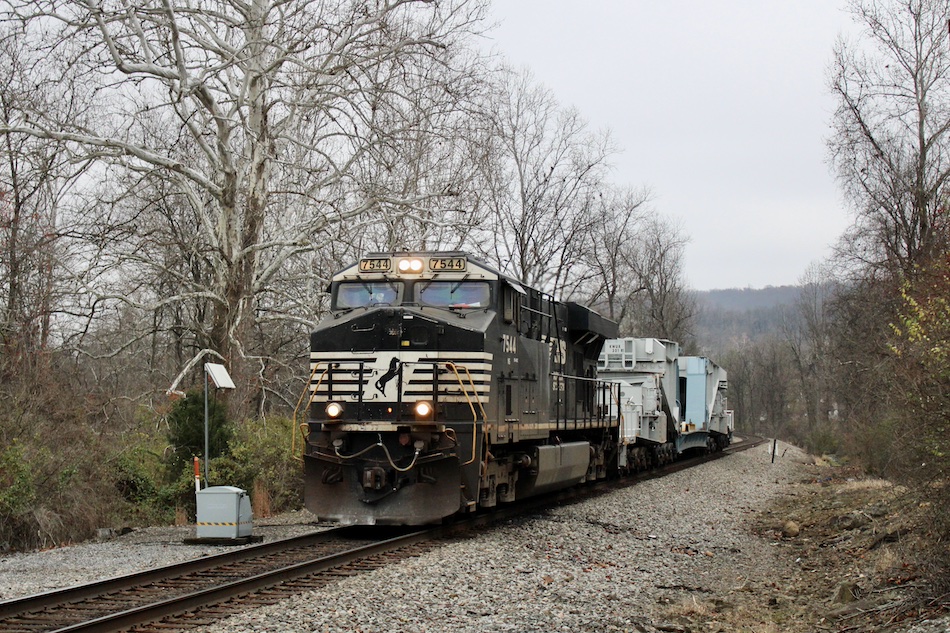 A Norfolk Southern train passes by a defect detector.