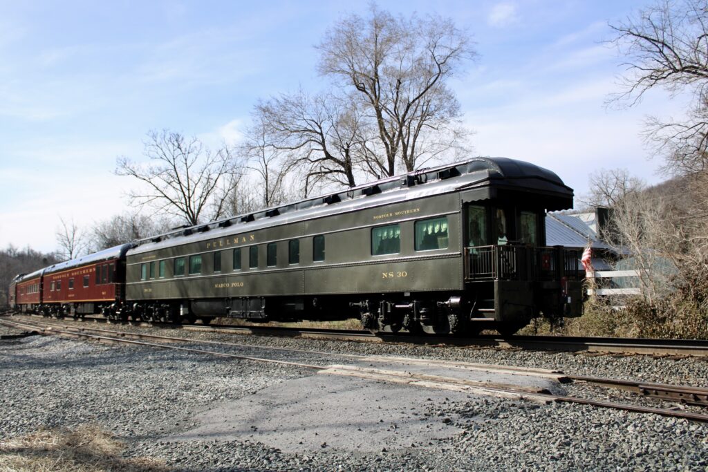 A green pullman car named Marco Polo is on the rear of a Norfolk Southern Office Car Special in Virginia.